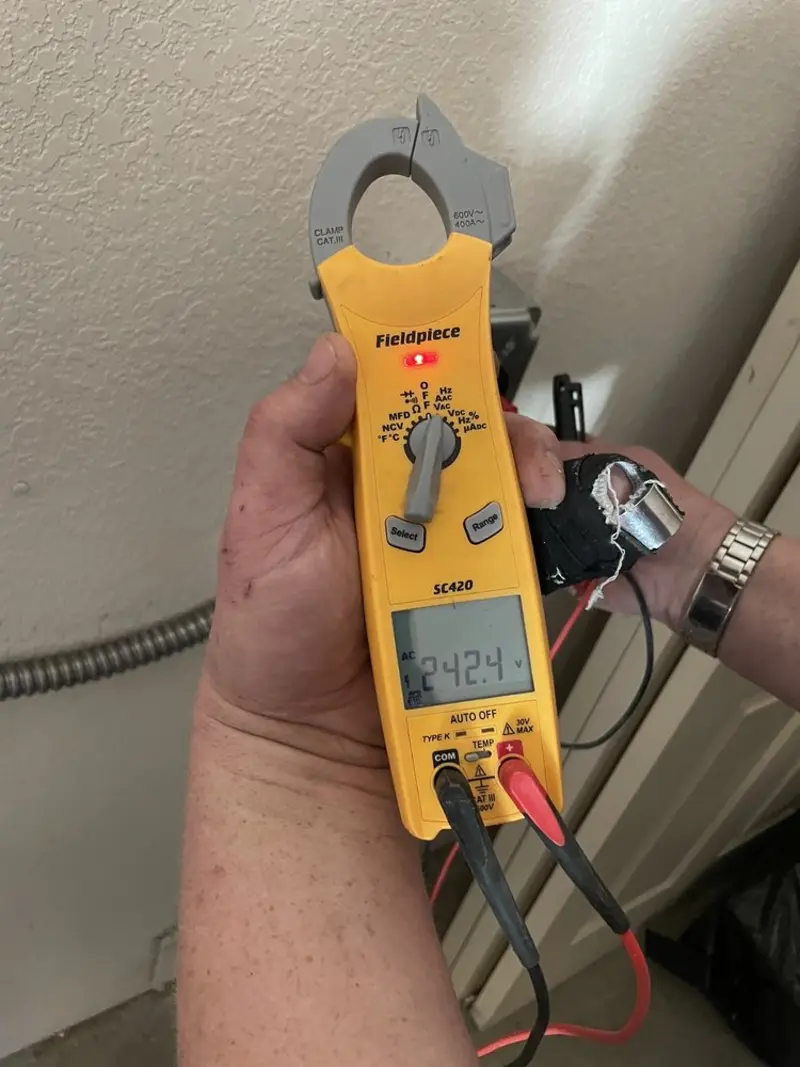 Voltage testing with clamp meter during Generator Installation in Preston